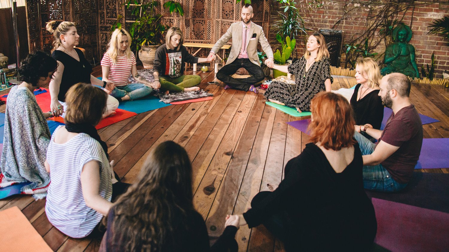 Nathaniel Hodder-Shipp leading a seated breathwork circle for Breathwork for Recovery
